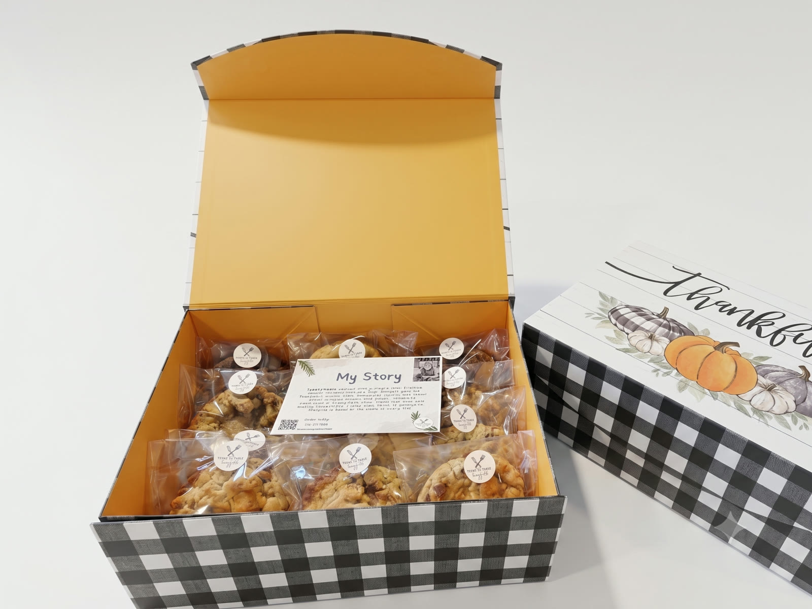 A plaid Thankful box packed with wrapped cookies